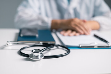 Canvas Print - Doctor clasped their hands in prayer, hoping for the best as they provided medical care in hospital clinic. doctor, pray, medicine, health, medical, hand, hospital, care, clinic, hope, prayer, person.