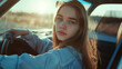 © VK Studio - A young woman with a calm expression sits in a car during sunset, embodying a sense of freedom and reflection.
