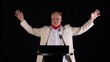 © serikbaib - Male politician with microphone on podium