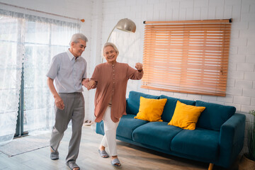 Wall Mural - Celebrating Retirement: Elderly Couple Embrace Love and Happiness at Home, Fun-filled Life of Dancing, Smiling, and Bonding Together, Cherishing Family and Romance in Their Golden Years