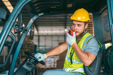 Wall Mural - Efficient Factory Logistics, Men at Work Safely Operating Forklifts in Warehouse for Distribution Storage, Managing Freight and Stock with Care, Ensuring Safe Handling of Packages and Transportation