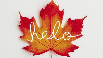 Hello Autumn text on maple leaf