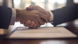 © Steve - Close-Up of Signed Series B Deal on Shiny Wood Table Amidst Celebratory Handshake