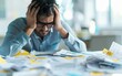 © patcharida - Businessman stressed over a pile of tax bills and receipts, Tax Burden, Financial Stress