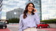 © PeopleVideos - Beautiful, young businesswoman talking on mobile phone and enjoying in the city