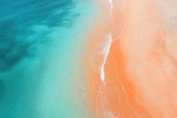 Wall Mural - Aerial view of a stunning beach showcasing contrasting turquoise water and soft orange sand, perfect for vacation imagery.