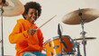 © MikeLegend - Young african american boy playing drums with a smile