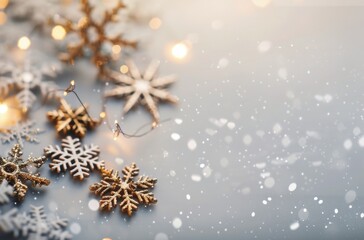 glittering snowflakes and ornaments on a white surface for holiday celebrations