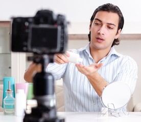 Wall Mural - Young handsome man recording his blog in hygiene concept