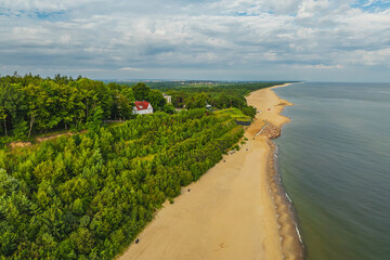 View from a drone of the beach in Jastrzębia Góra in the morning in summer.