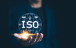 © Supatman - ISO Standards and Quality Assurance Concept. Businessman presenting globe with various ISO icons symbolizing standards and quality assurance, represent International Organization for Standardization.