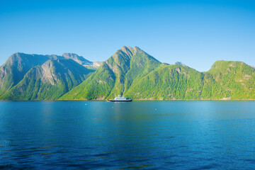 Wall Mural - view of a fjord in norway. ferry for transportation of vehicles. nature in fjords. high mountains an