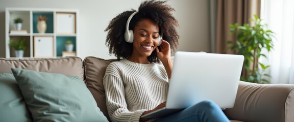 Happy Woman Using Laptop and Headphones at Home.