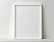 © ModernGallery - White vertical frame hanging on a white wall mockup