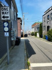 Directional One Way Traffic Sign Driving Tour on Spring Wharf Harbor Cove Off of Historic Market Thames Street. Popular Summer Destination Downtown City Buildings Newport RI Rhode Island USA America