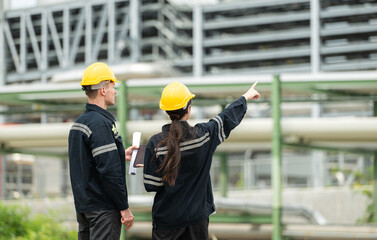 Both of Petroleum engineer is on a mission to inspect oil distillation at a huge oil refinery