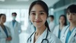 © atar - a group of asian young happy doctors smile
