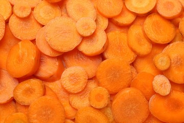 Wall Mural - Slices of fresh ripe carrot as background, top view