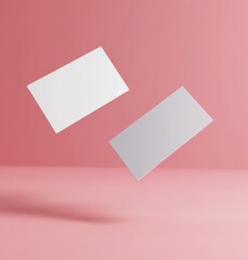 two blank cards or papers floating in the air, behind is a solid color background, mockup type, professional product photography