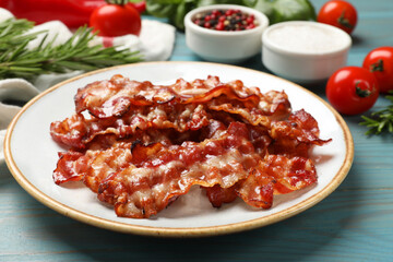 Wall Mural - Slices of tasty fried bacon and different spices on light blue wooden table, closeup