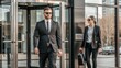 © N7 - Corporate executive with security guard at office entrance