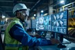 © Valentin - Industrial Worker Monitoring Operations on Multiple Screens in a High-Tech Environment