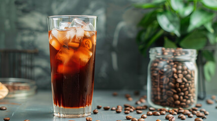 Poster - Tall glass of cold brew coffee with ice cubes next to a jar of coffee beans