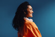 © Jacob Lund - Smiling woman with headphones in side profile, vibrant color blocking and colorful setting