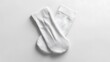 © horizon - A pair of plain white cotton socks, ribbed texture, athletic style, folded neatly, top-down view, crisp details, soft shadows, minimalist composition, white background, product photography.