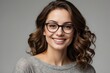 © Magic Art - professional studio portrait of a smiling woman with short curly hair and glasses