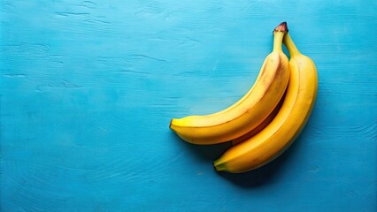 Two ripe bananas positioned on a vibrant blue background, bananas, fruit, yellow, healthy, snack, tropical, duo, vibrant, fresh