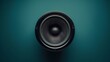 © MaxStock - Close-Up of a Black Speaker on Teal Background