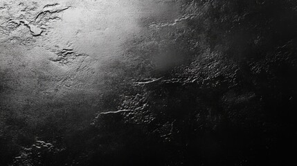 Aufkleber - A dark, textured surface features subtle light reflecting off its uneven patterns, creating a dynamic visual effect