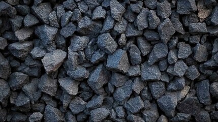 Aufkleber - A collection of dark gravel rocks scatters across a surface, showcasing their rough textures and varying sizes, typically used in construction