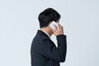 © One - 電話をする50代男性の横顔