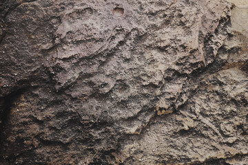 Wall Mural - Empty brown stone wall or rock for abstract  background and texture. beautiful patterns, space for work, banner,seamless wallpaper, close up.