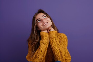 Young Slovak woman isolated on purple background looking up while smiling