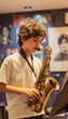© spyrakot - Young Boy Practicing Saxophone in Soundproof Music Room with Music Stands and Posters