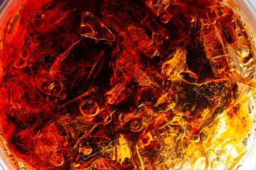 Wall Mural - Macro cola background,Background of cola with ice and bubbles. Side view background of refreshing cola flavored soda with carbonated with vintage tone,Thailand, Turkey - Middle East, Cola, Soda, Bubbl