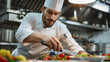 © GoshaMovies - the cook prepares food in the restaurant. International Chefs Day.
