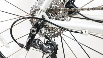 Closeup of modern bicycle gears, chain, and derailleur system, showcasing intricate mechanical details, cycling equipment concept