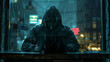 © wiparat - darkened hacker person hidden behind a dark hood and sitting at a laptop