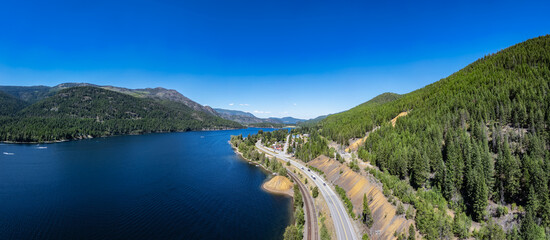 Wall Mural - Aerial View of Highway by the lake and mountains. BC, Canada.