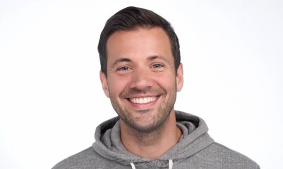 Wall Mural - Portrait of a handsome young man smiling and looking at the camera