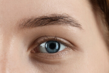 Poster - Woman with beautiful blue eyes, macro photo