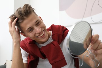 Poster - Handsome man looking at mirror at home