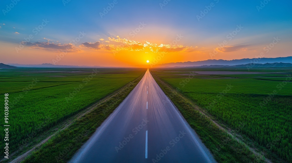 Open Road Towards a Golden Sunset - A long straight road stretches ...