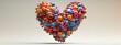 © I Am The Future - Heart-shaped abstract sculpture made of colorful spheres against a neutral background.