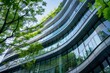 © viktorbond - eco friendly modern glass office building with green environment