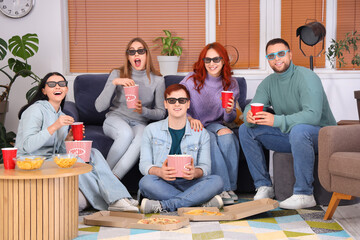 Canvas Print - Group of young friends in 3D glasses with beer and popcorn watching movie at home